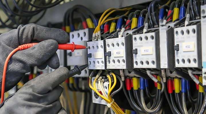 Electrician With Gloves Testing