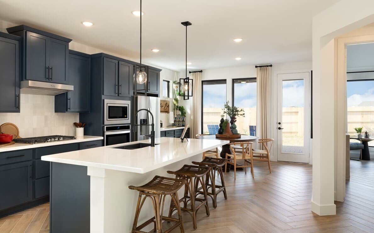 Navy blue kitchen in the Rutger floor plan by Brookfield Residential in Houston TX 1189