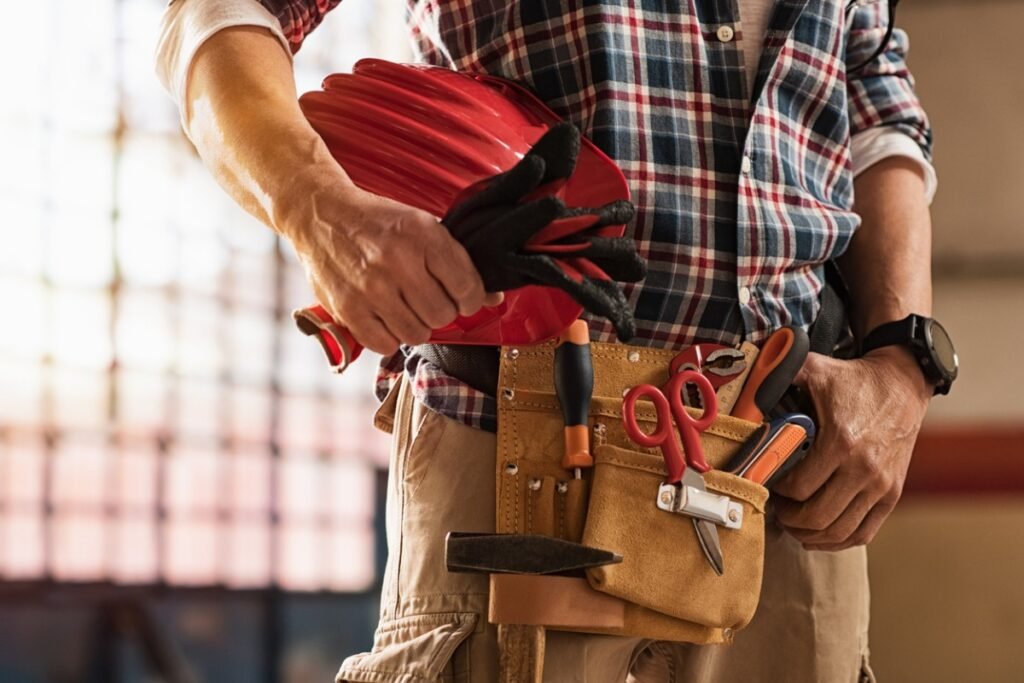 bricklayer holding construction tools picture id901089886