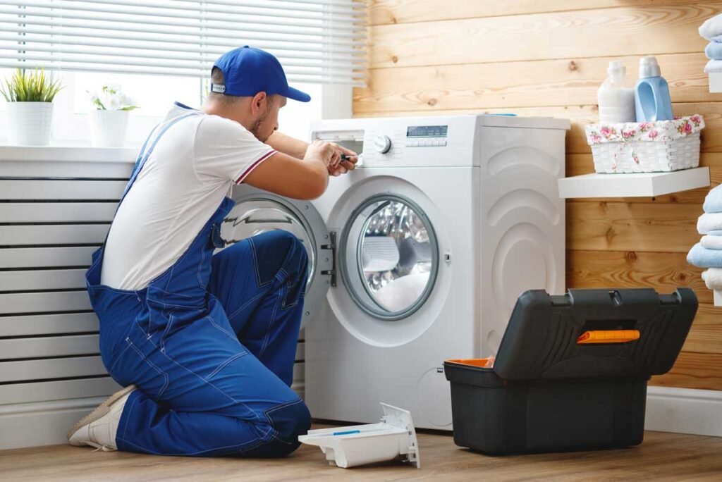 man repairing washing machine jpg