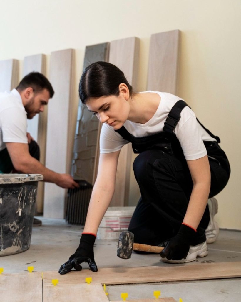 workers-tiling-floor-indoors